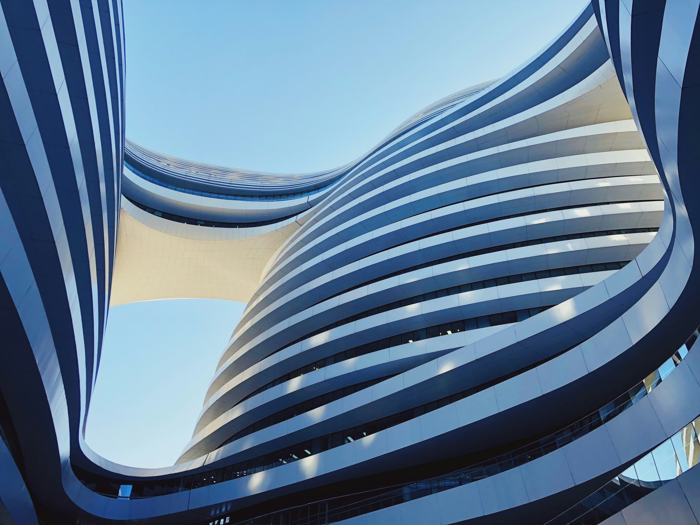 The sweeping curved balconies of a modern apartment building
